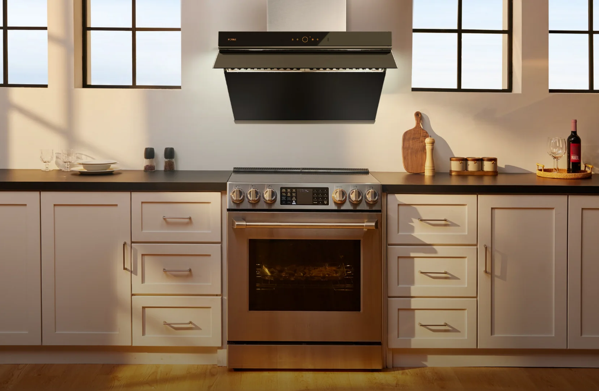 Kitchen with Fotile range hood and range
